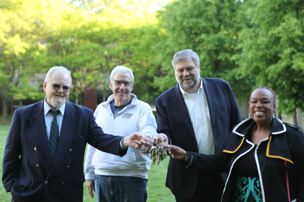 On Monday night, Wagner College leadership taking the keys to the former SJU campus. From left, Jim Chiavelli, VP/External Affairs; Stuart Goldberg, VP & CFO; Dr. Jeffrey Doggett, President; and Dr. Jazzmine Clarke-Glover, Chief of Staff and Executive VP/COO. Image Credit - Wagner College