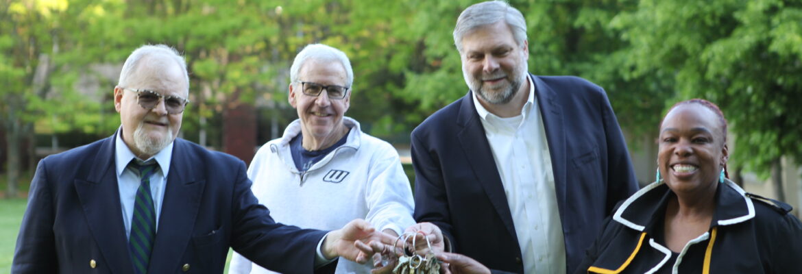On Monday night, Wagner College leadership taking the keys to the former SJU campus. From left, Jim Chiavelli, VP/External Affairs; Stuart Goldberg, VP & CFO; Dr. Jeffrey Doggett, President; and Dr. Jazzmine Clarke-Glover, Chief of Staff and Executive VP/COO. Image Credit - Wagner College