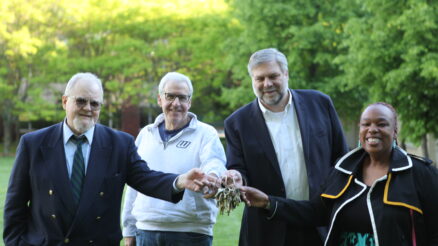 On Monday night, Wagner College leadership taking the keys to the former SJU campus. From left, Jim Chiavelli, VP/External Affairs; Stuart Goldberg, VP & CFO; Dr. Jeffrey Doggett, President; and Dr. Jazzmine Clarke-Glover, Chief of Staff and Executive VP/COO. Image Credit - Wagner College